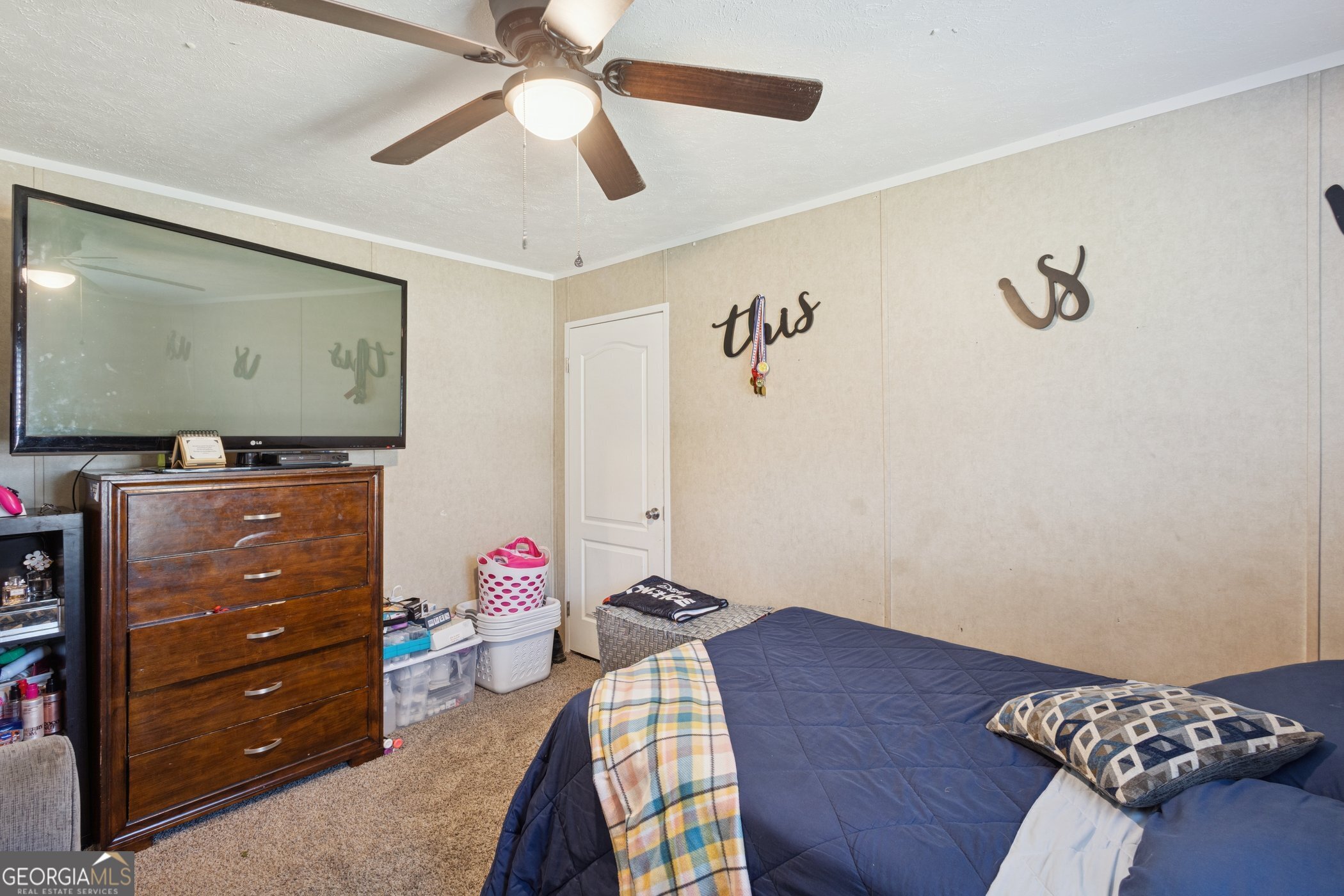 1238 Reedsville Road Clyo, GA 31303 - Photo 24 of 30 a bedroom with a bed and wooden floor