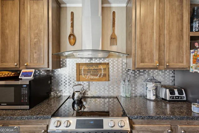 a kitchen with a stove and a microwave