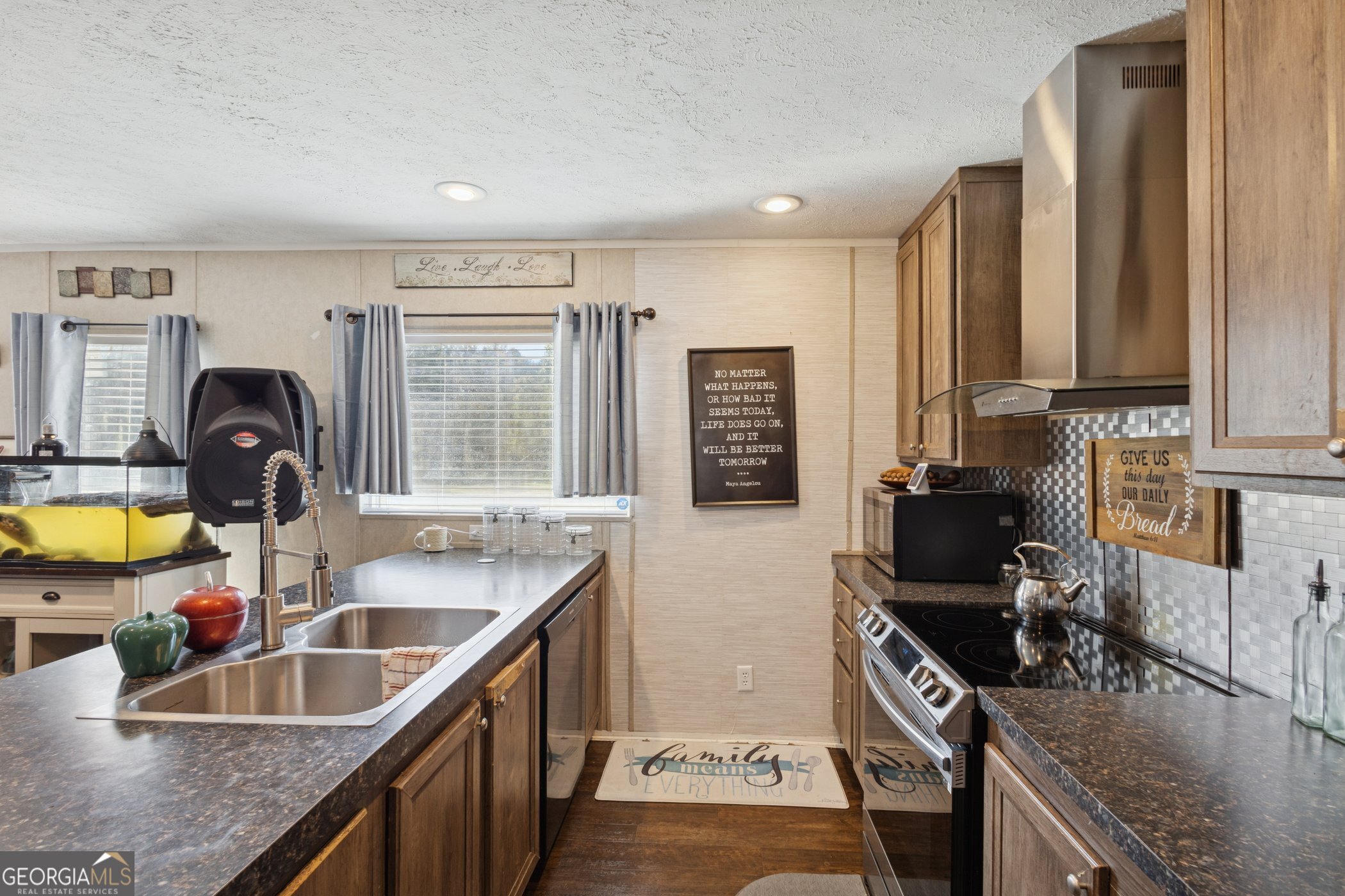 1238 Reedsville Road Clyo, GA 31303 - Photo 7 of 30 a kitchen with a sink stove and cabinets