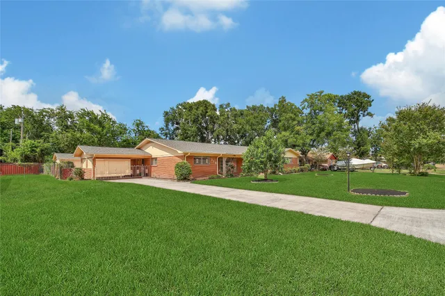 a view of a cars park in front of a building
