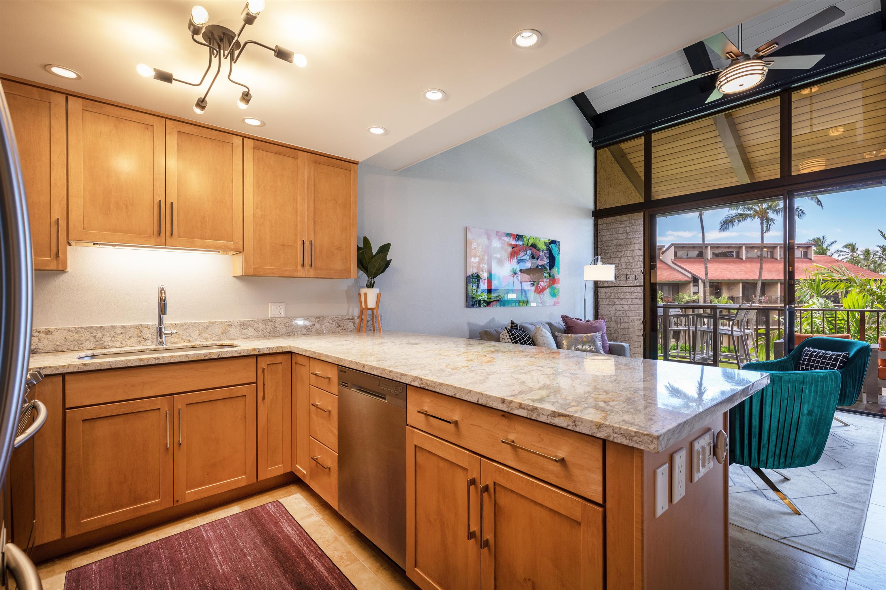 940 South Kihei Road, Unit B309 Kihei, HI 96753 - Photo 18 of 29 a kitchen with stainless steel appliances granite countertop a sink and cabinets