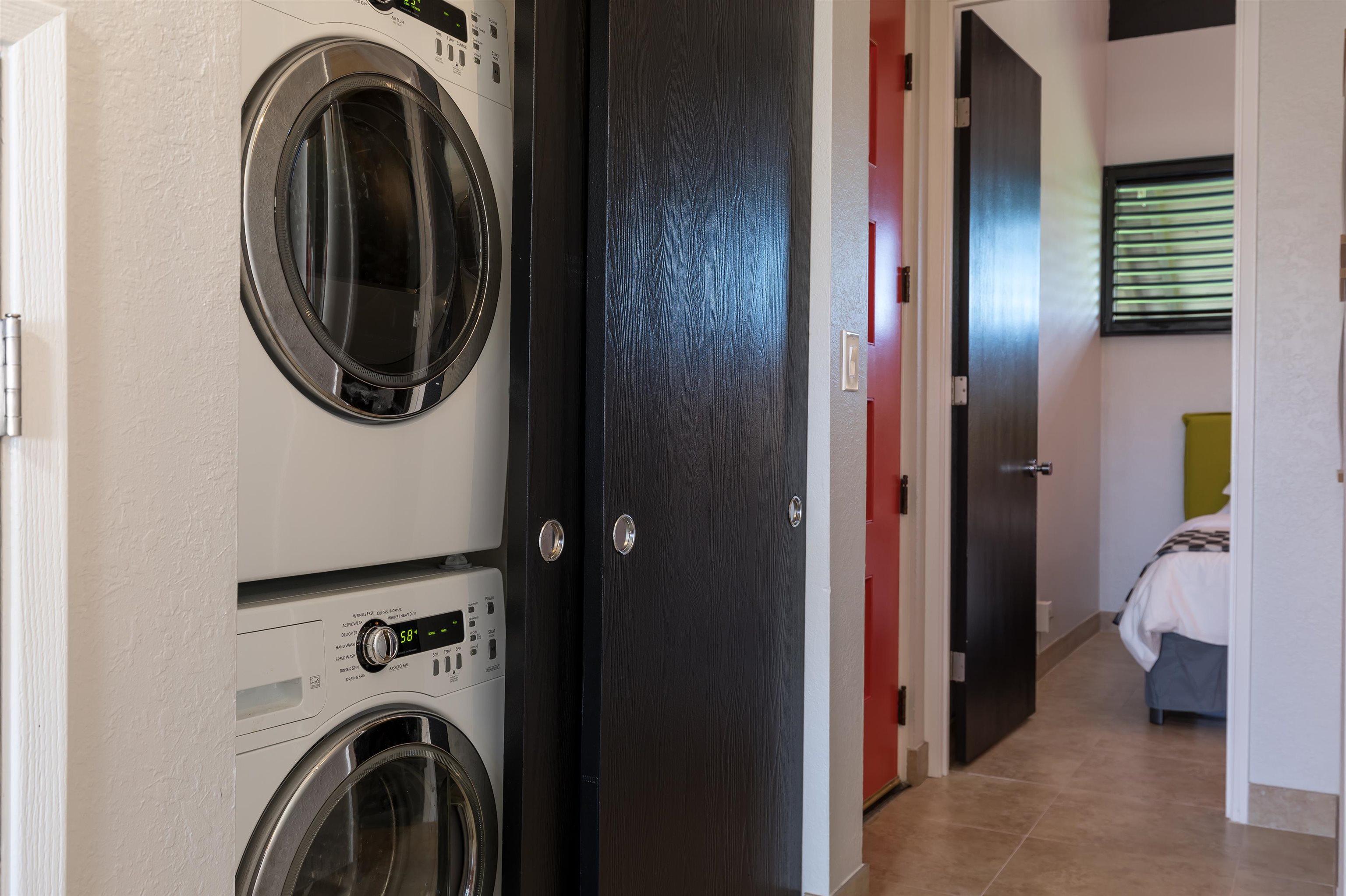 940 South Kihei Road, Unit B309 Kihei, HI 96753 - Photo 19 of 29 a view of a storage and utility room with washer and dryer
