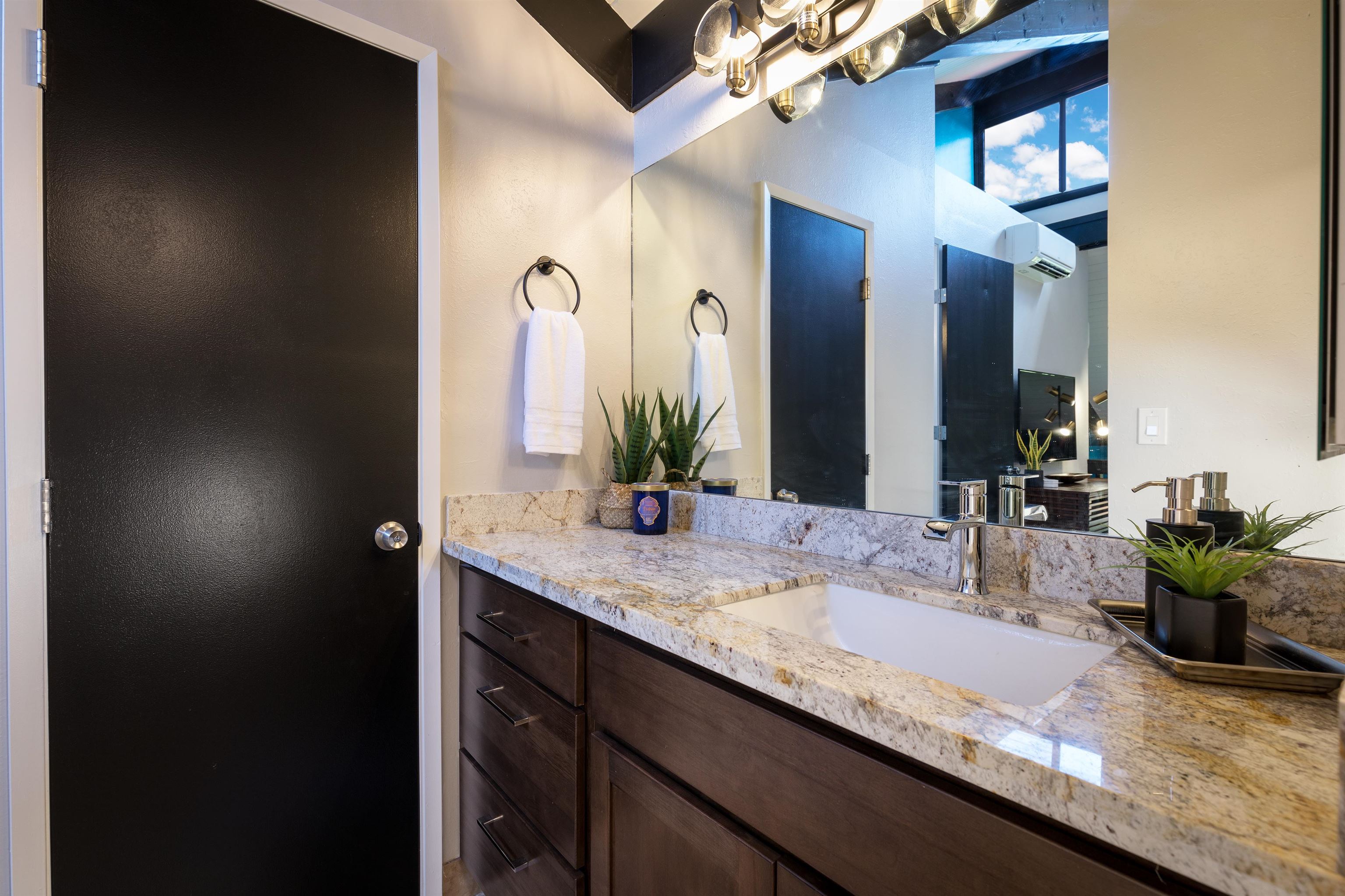 940 South Kihei Road, Unit B309 Kihei, HI 96753 - Photo 20 of 29 a bathroom with a granite countertop sink a mirror and a potted plant
