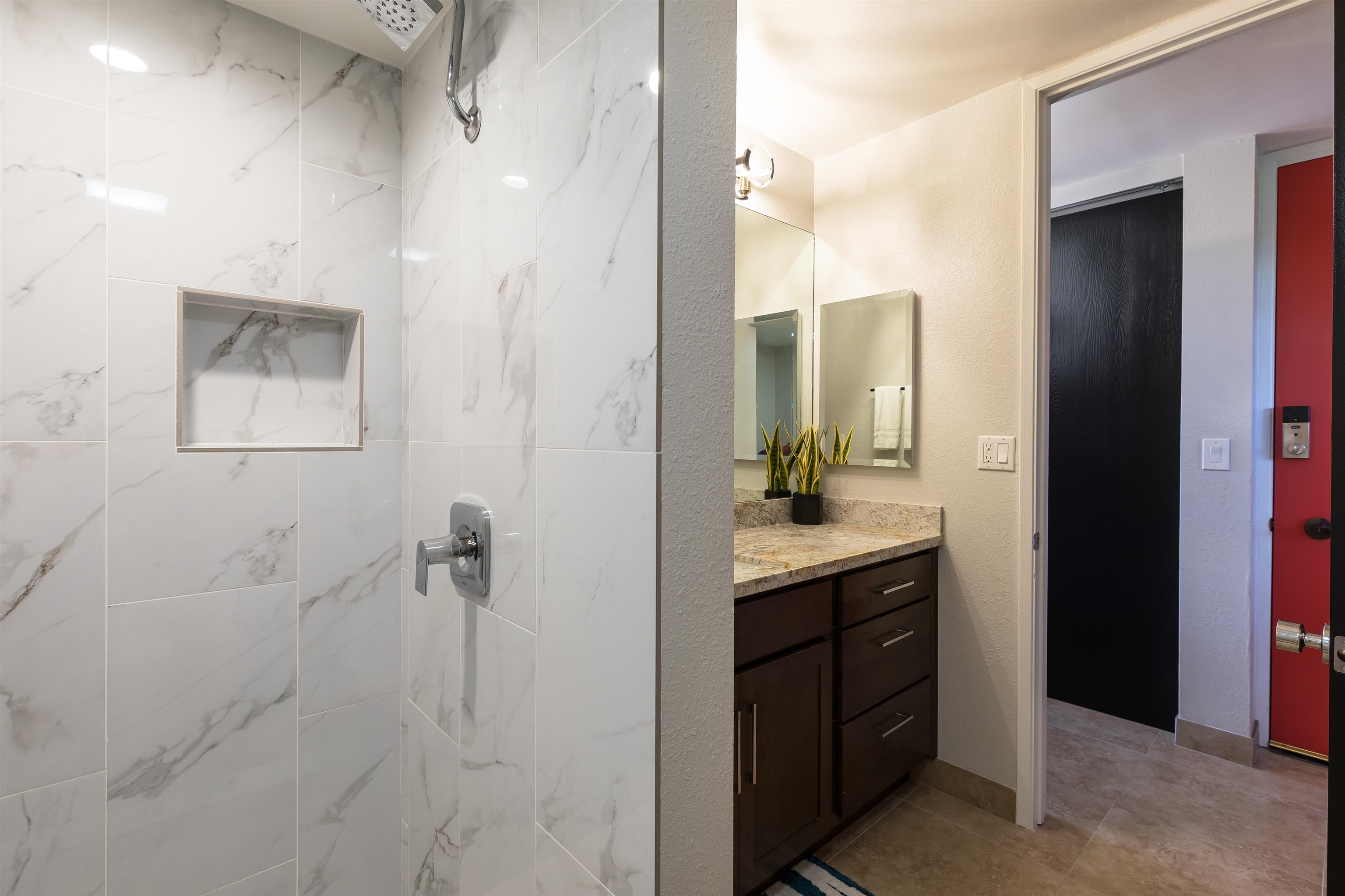 940 South Kihei Road, Unit B309 Kihei, HI 96753 - Photo 21 of 29 a bathroom with a granite countertop sink a mirror and a shower