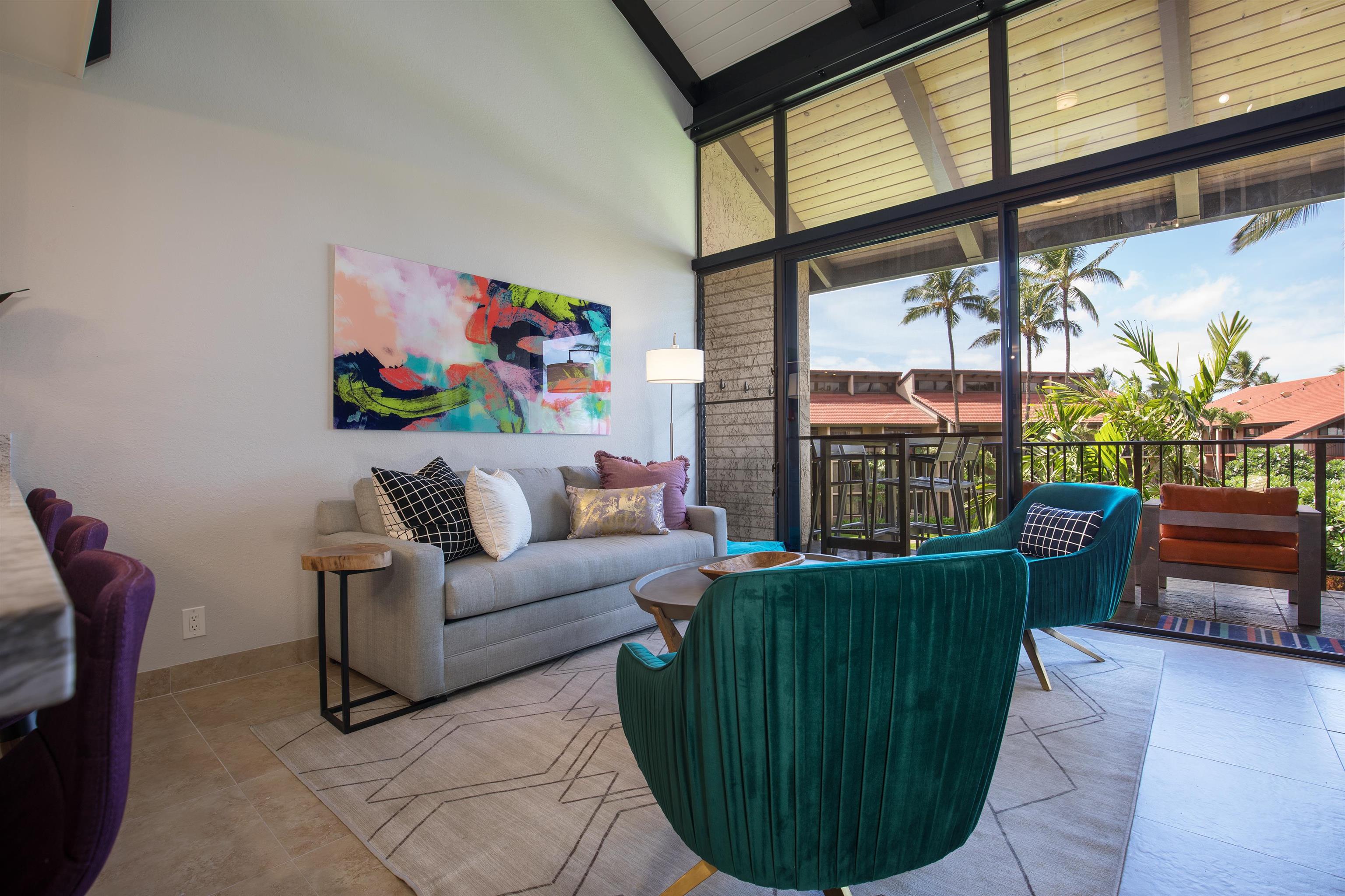940 South Kihei Road, Unit B309 Kihei, HI 96753 - Photo 4 of 29 a living room with furniture and a large window