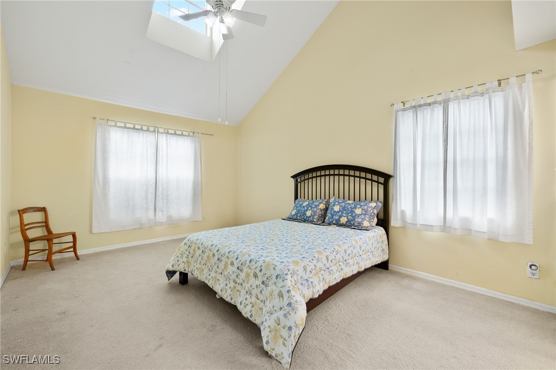 17416 Lee Road Fort Myers, FL 33967 - Photo 15 of 26 a bedroom with a bed and a window