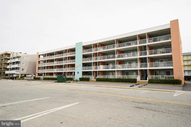 a view of a building with a street