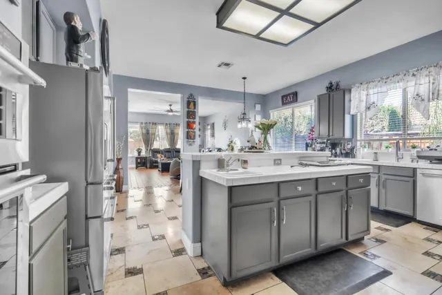 a bathroom with a double vanity sink a mirror and shower