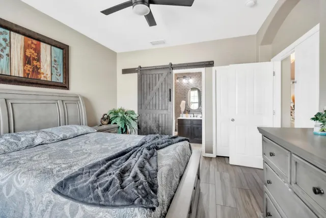 a bedroom with a bed and a dresser