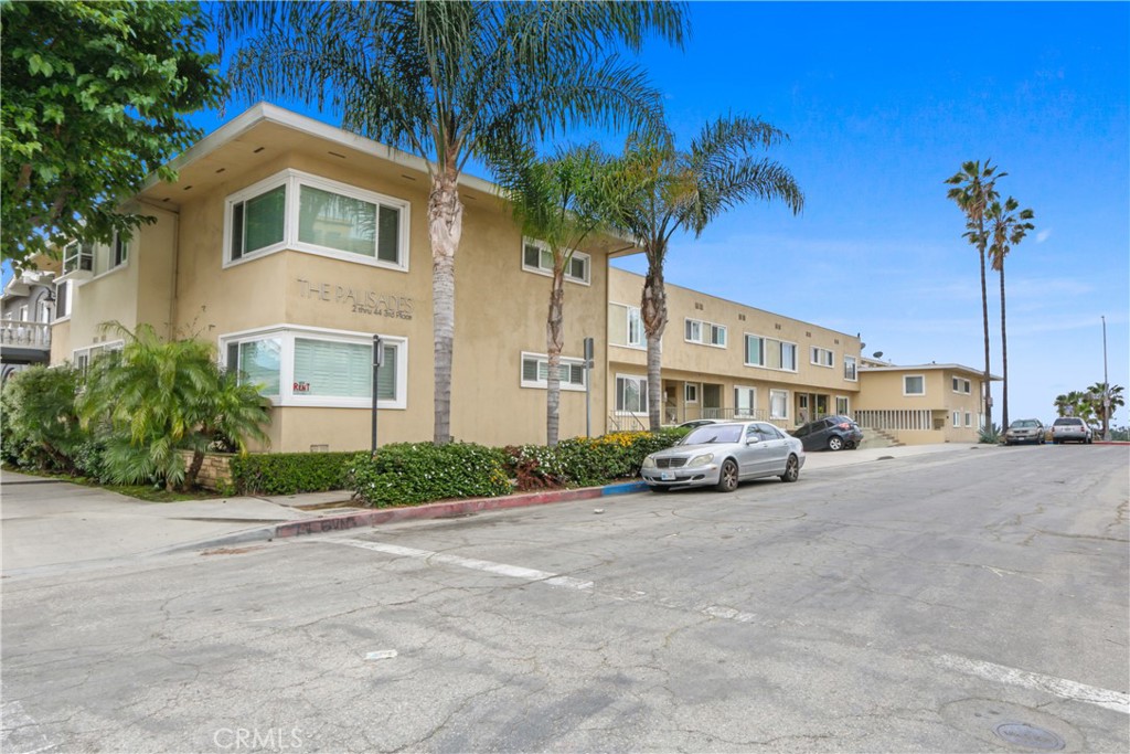 a front view of a house with a yard and a garage