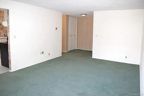 a kitchen with stainless steel appliances granite countertop a refrigerator a stove a sink and dishwasher