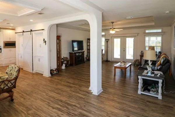 a view of a livingroom with furniture and a flat screen tv