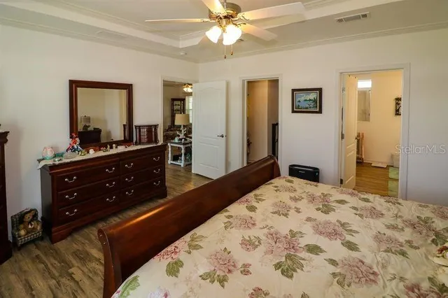 a bedroom with a bed and a dresser in it