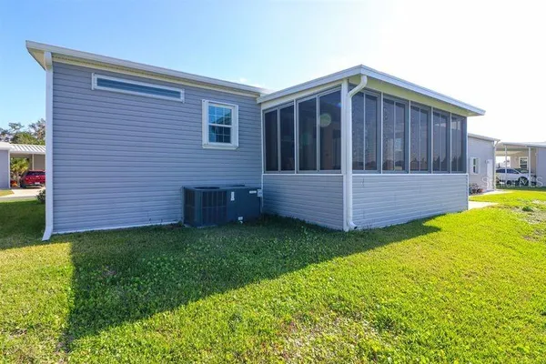 a view of a backyard with wooden fence