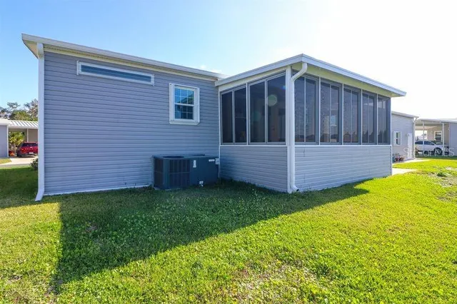 a view of a backyard with wooden fence