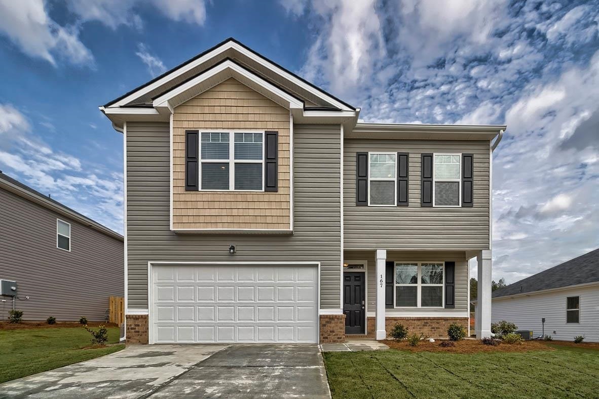 3325 Loblolly Pine Way, Unit 107 Decatur, GA 30034 - Photo 1 of 1 a front view of a house with a yard