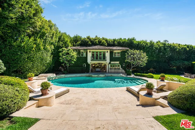 a view of a swimming pool with a patio