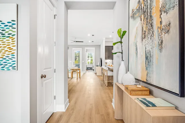 a view of an entryway with wooden floor