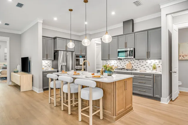 a large kitchen with a table and chairs