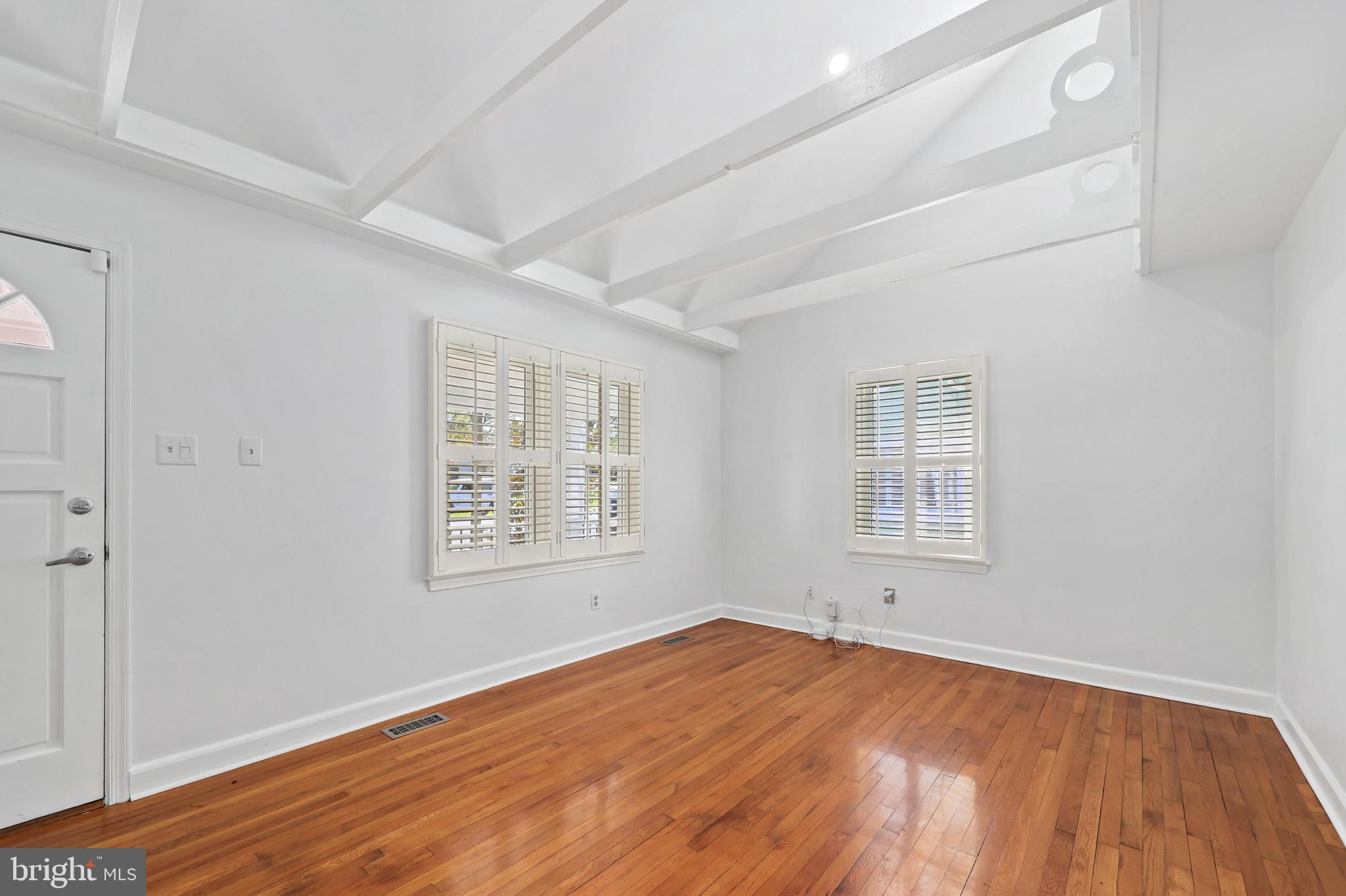 9106 Battle Street Manassas, VA 20110 - Photo 12 of 50 an empty room with wooden floor and windows