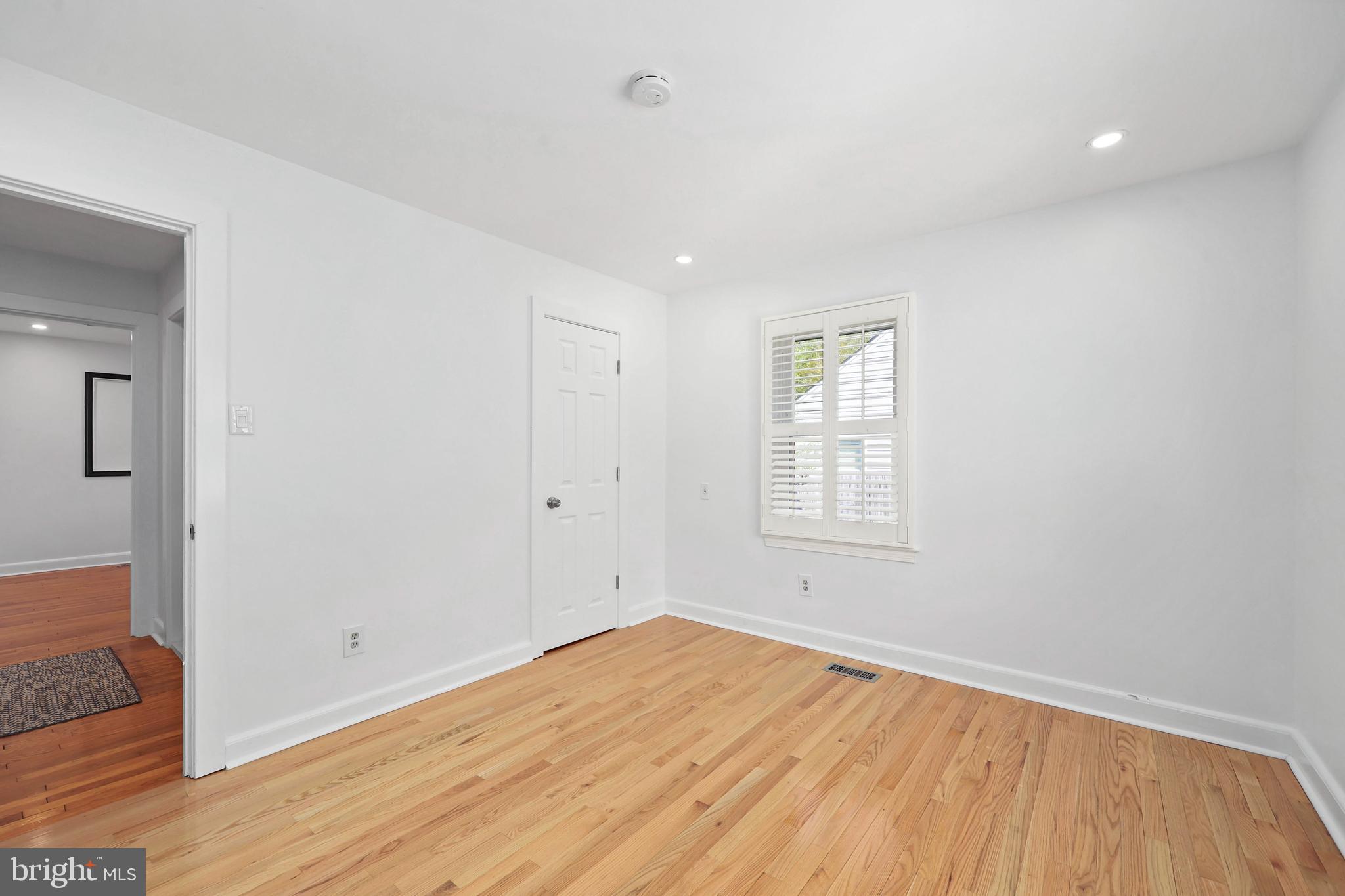 9106 Battle Street Manassas, VA 20110 - Photo 15 of 50 a view of empty room with wooden floor and fan