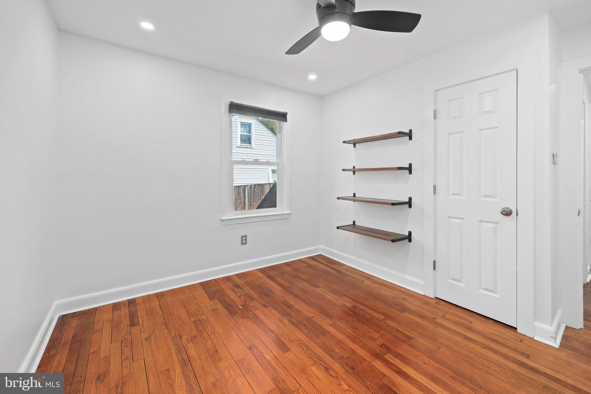 9106 Battle Street Manassas, VA 20110 - Photo 19 of 50 wooden floor in an empty room with a window