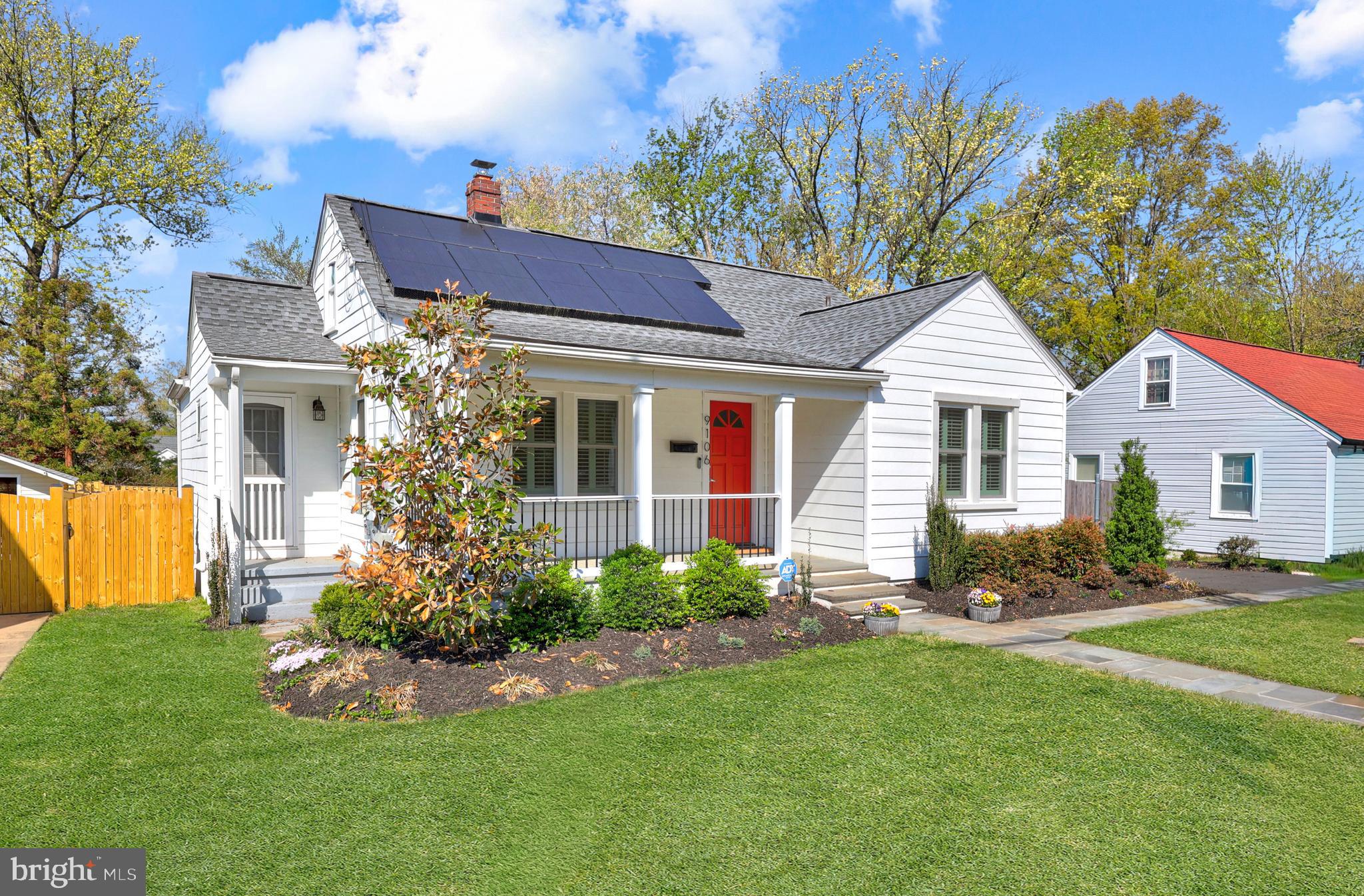 9106 Battle Street Manassas, VA 20110 - Photo 2 of 50 a front view of a house with a yard and outdoor seating