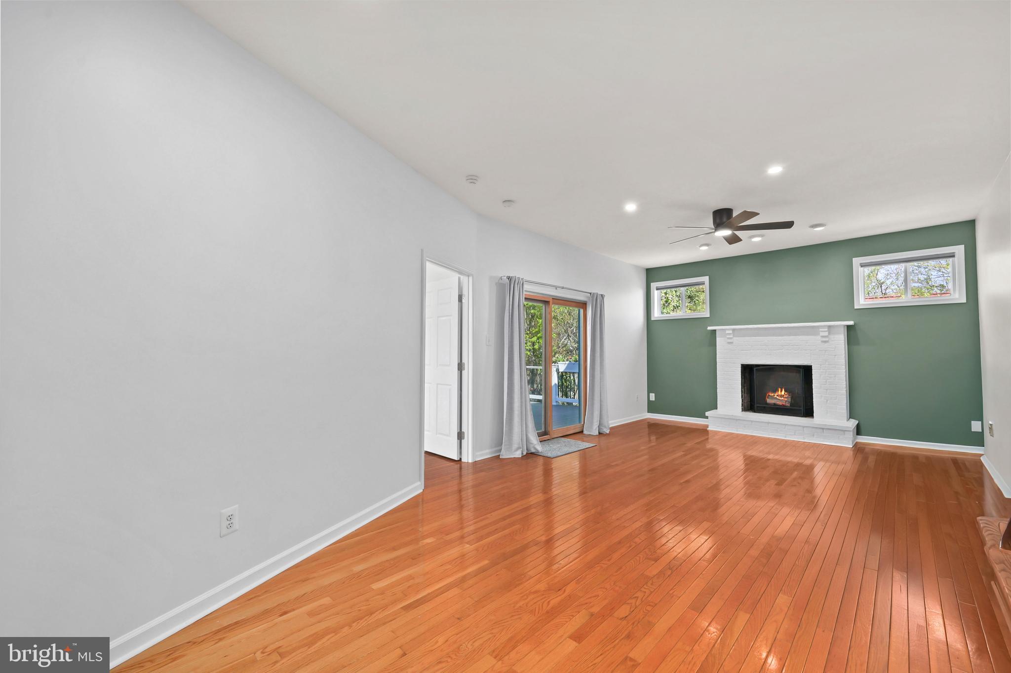 9106 Battle Street Manassas, VA 20110 - Photo 28 of 50 a view of a livingroom with an empty room and fireplace