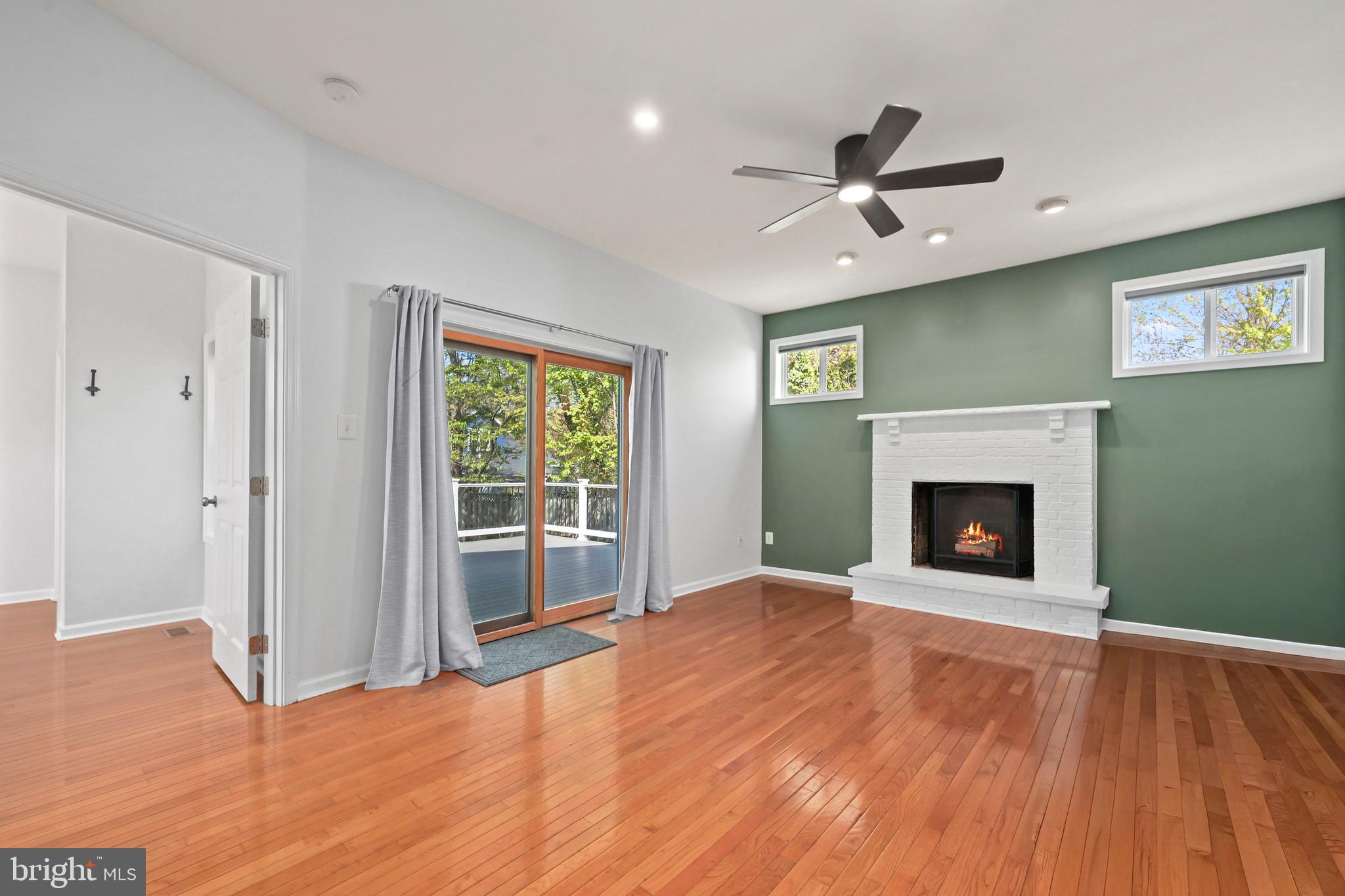 9106 Battle Street Manassas, VA 20110 - Photo 33 of 50 a view of an empty room with a fireplace and a window