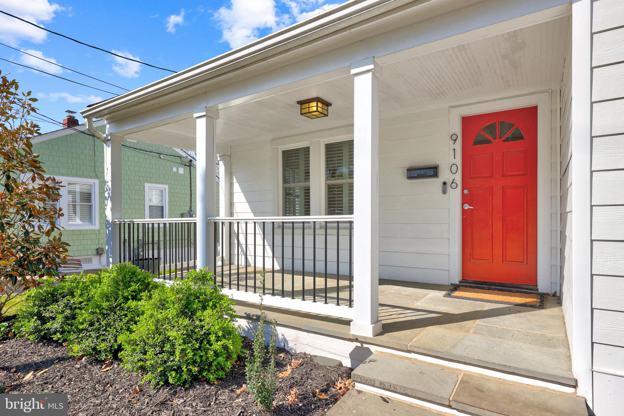 9106 Battle Street Manassas, VA 20110 - Photo 4 of 50 a front view of a house with a porch