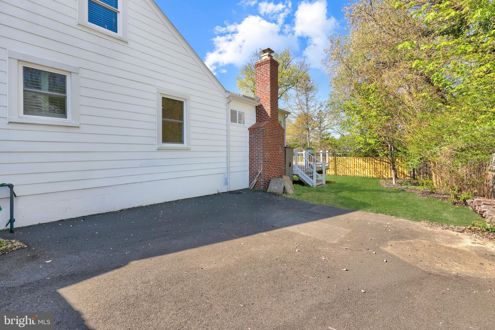 9106 Battle Street Manassas, VA 20110 - Photo 6 of 50 a view of a house with garage and a yard