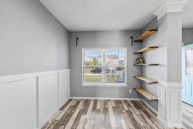 a view of walk in closet with empty racks