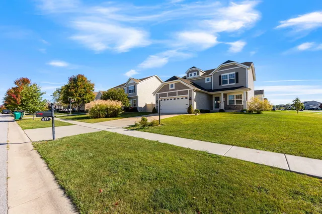 a house with swimming pool in front of it