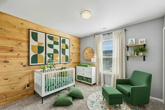 a bedroom with furniture and a window