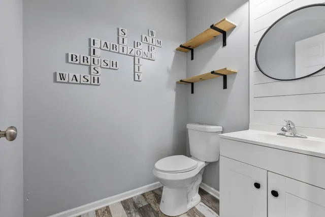 a bathroom with a toilet and a sink