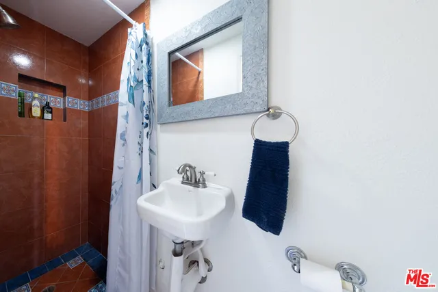 a bathroom with a sink and mirror