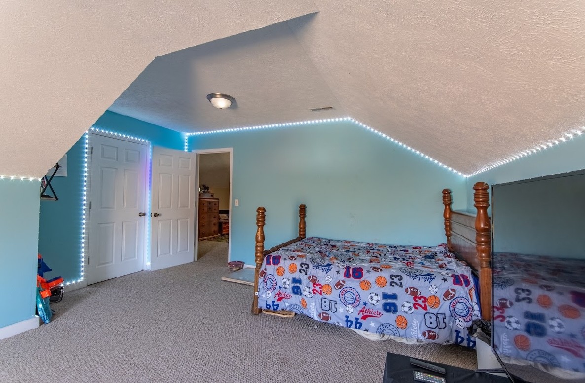 22 Ray Road Lawrenceburg, TN 38464 - Photo 36 of 72 a bedroom with a bed and a dresser