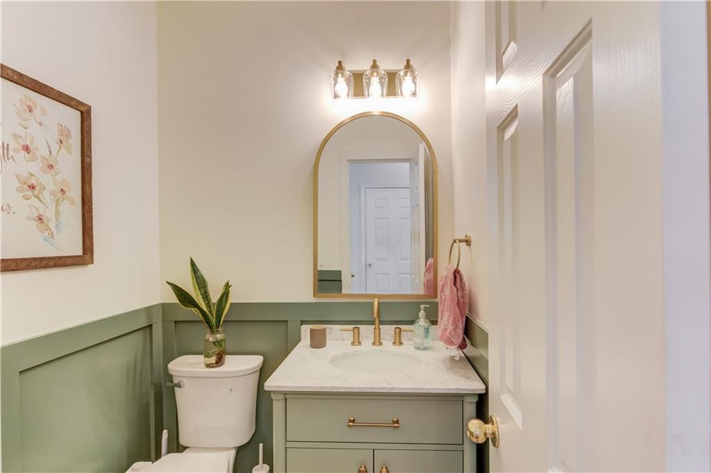 2310 Olde Hickory Place Monroe, GA 30656 - Photo 15 of 46 a bathroom with a sink mirror and toilet