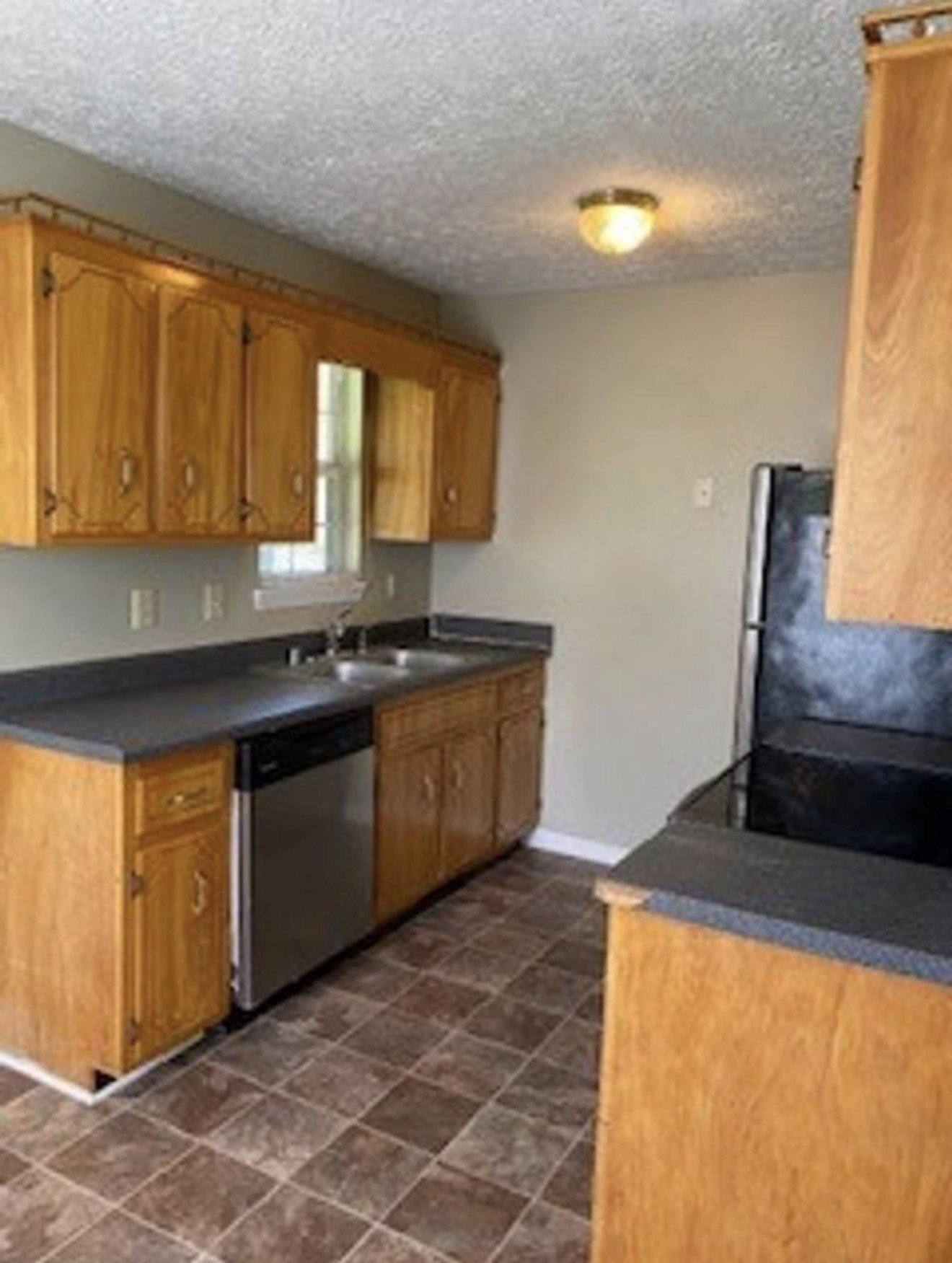 440 Pembroke Oak Grove Road Oak Grove, KY 42262 - Photo 3 of 9 a kitchen with granite countertop a stove a sink and a microwave