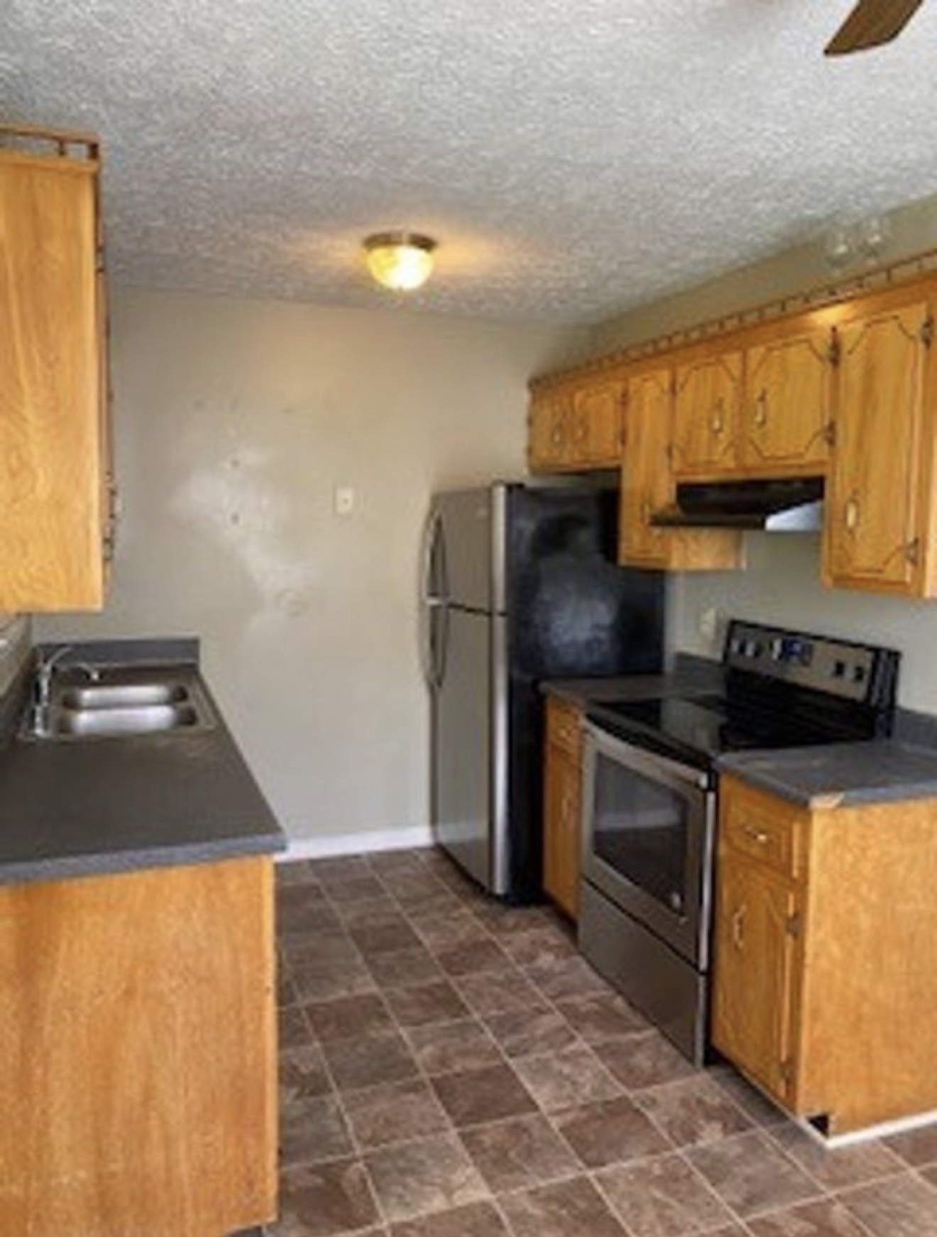 440 Pembroke Oak Grove Road Oak Grove, KY 42262 - Photo 4 of 9 a kitchen with stainless steel appliances granite countertop a stove a refrigerator and a sink