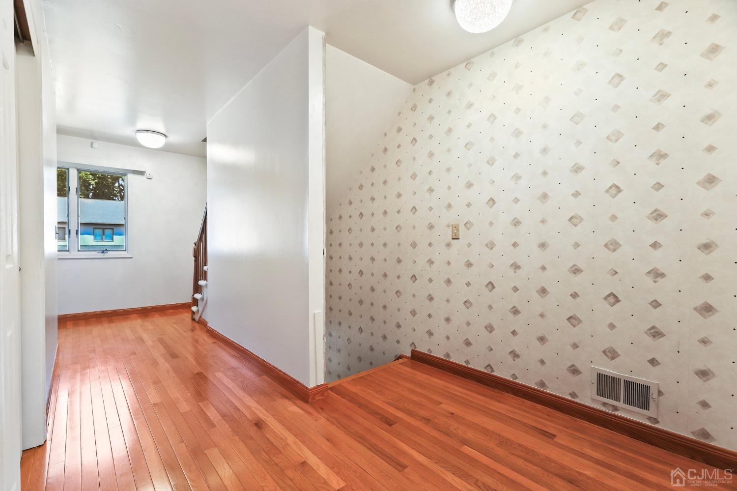 133 Redpine Loop Old Bridge, NJ 08857 - Photo 2 of 26 a view of wooden floor in an empty room