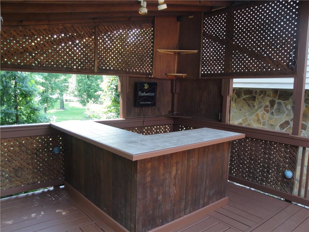 1349 Country Club Road Monongahela, PA 15063 - Photo 8 of 25 The outdoor bar area... Bar can seat up to 8 people... It is wired for lighting and cable... You can have your friends over to watch the big game...