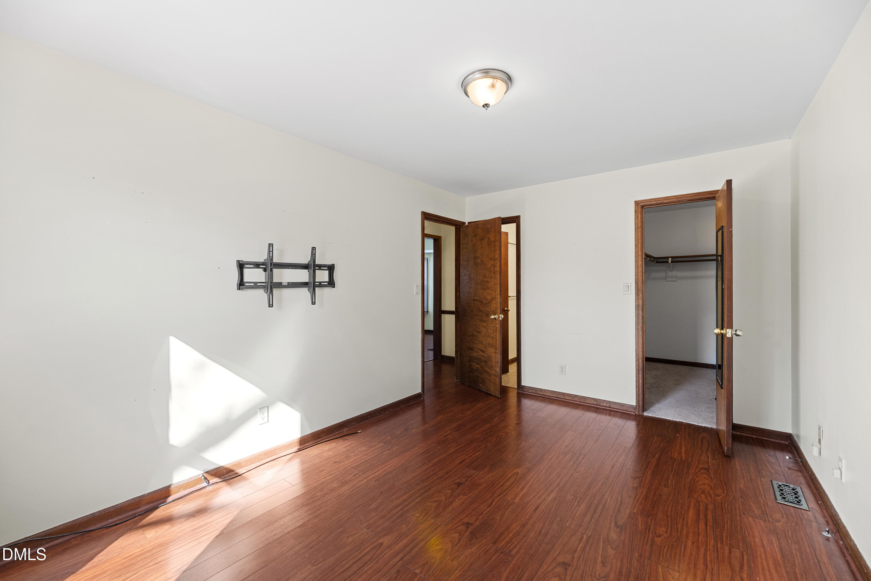 624 Wagstaff Road Fuquay-Varina, NC 27526 - Photo 12 of 39 an empty room with wooden floor and windows