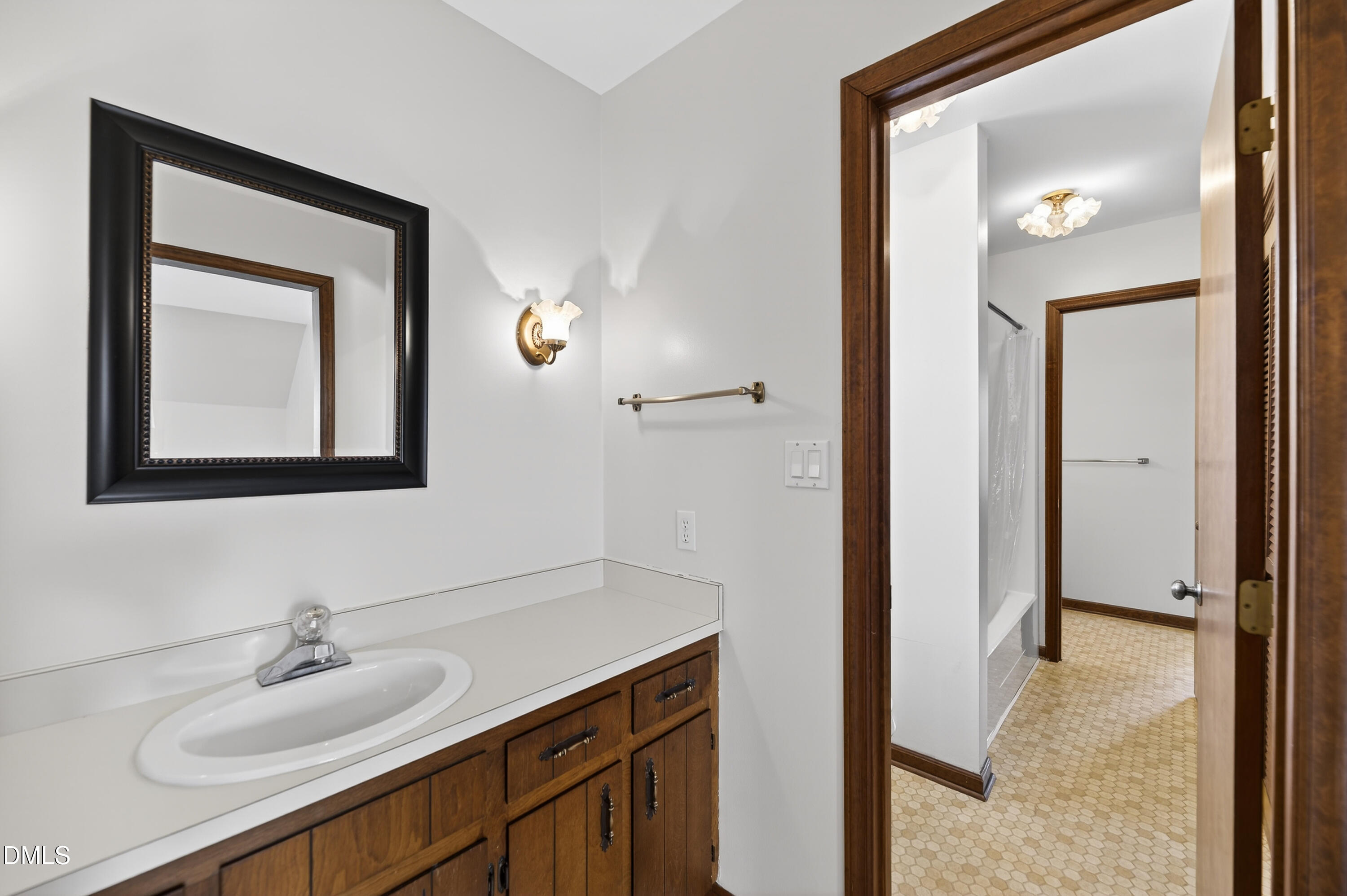624 Wagstaff Road Fuquay-Varina, NC 27526 - Photo 19 of 39 a bathroom with a sink vanity and a mirror