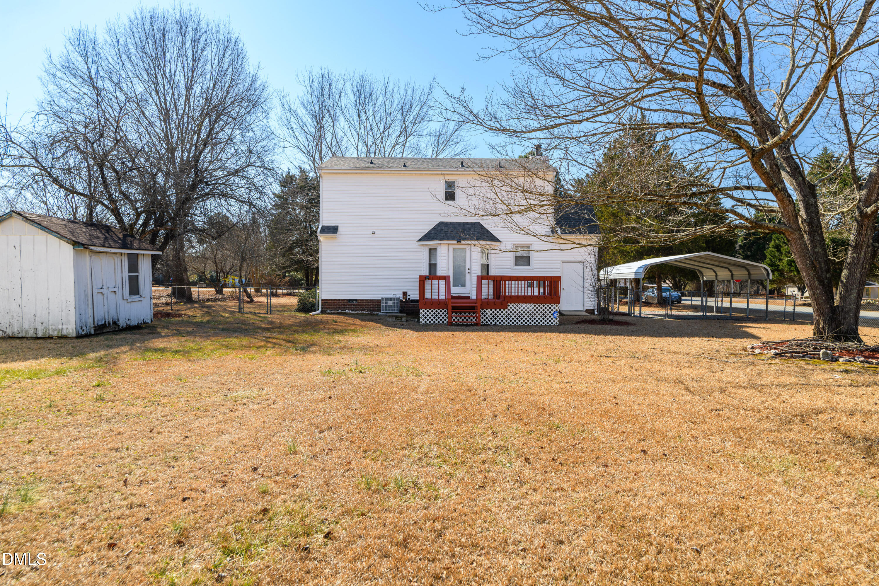 624 Wagstaff Road Fuquay-Varina, NC 27526 - Photo 22 of 39 a front view of a house with a yard covered with snow