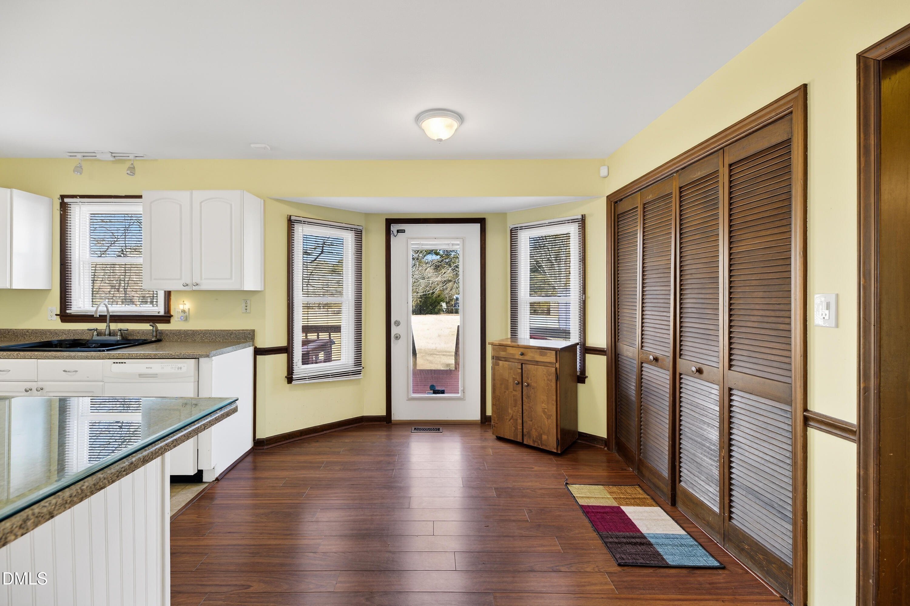 624 Wagstaff Road Fuquay-Varina, NC 27526 - Photo 6 of 39 a view of a large kitchen with a sink refrigerator and wooden floor