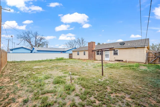 a house view with swimming pool in front of it