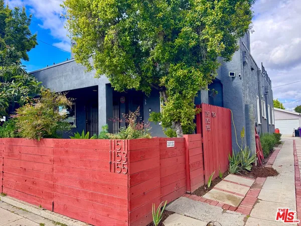 a view of a backyard with potted plants