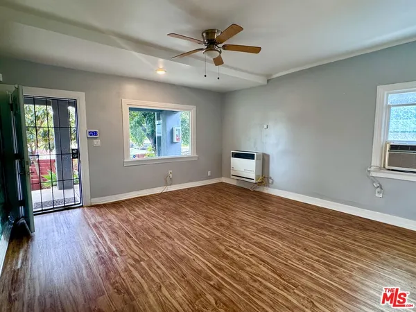 wooden floor that has a window in it