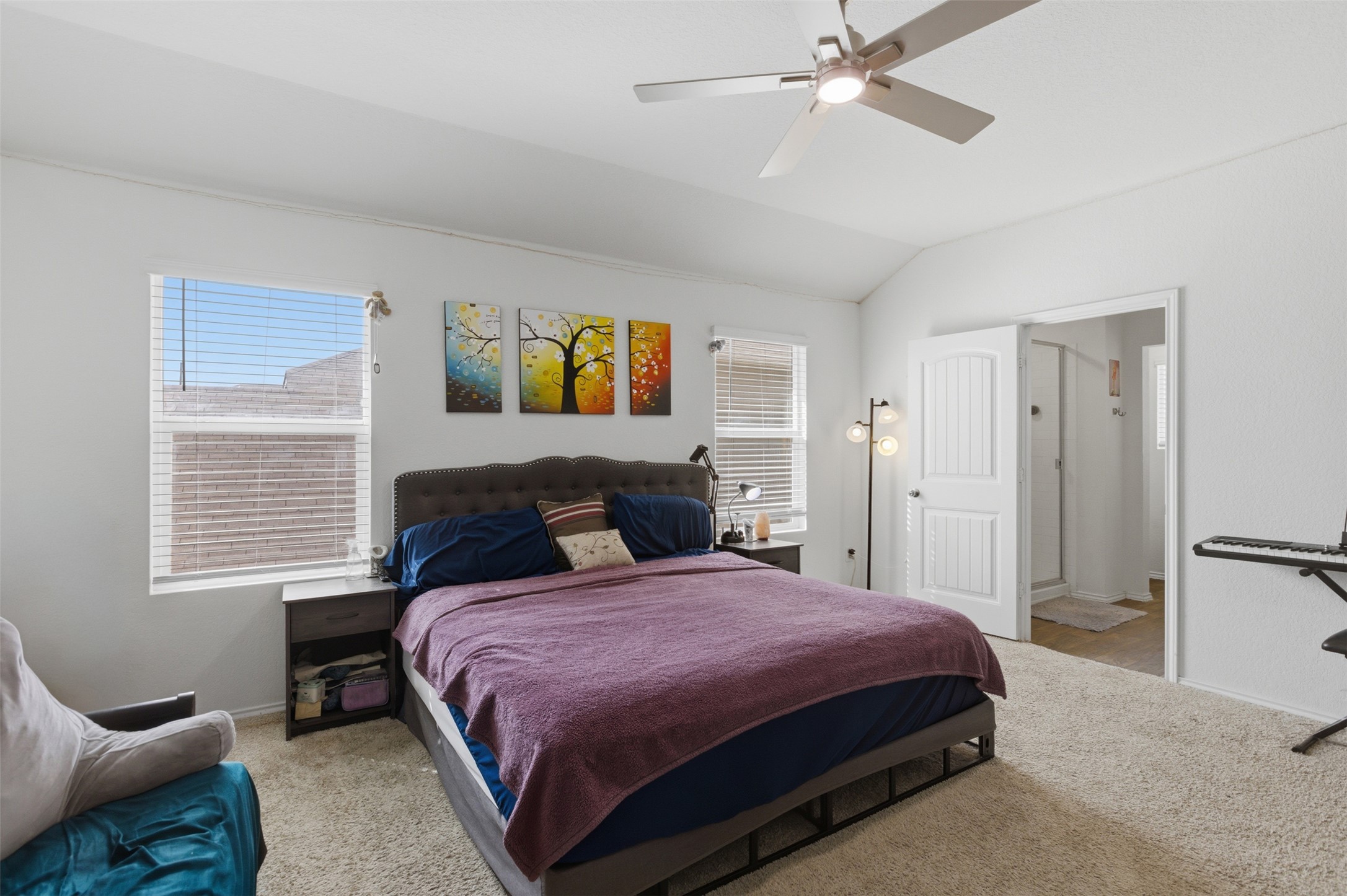 19017 Romano Drive Elgin, TX 78621 - Photo 25 of 33 Bedroom featuring a vaulted ceiling and a ceiling fan with integrated lighting